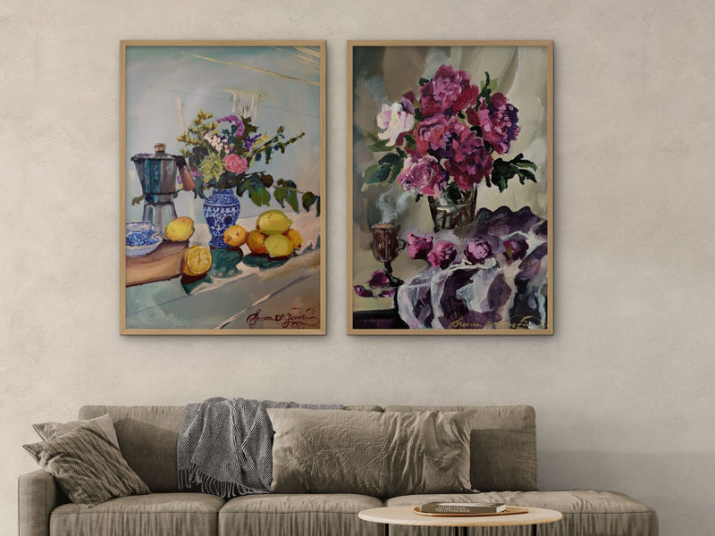 Two framed prints by Mariam De Giorgio, Morning coffee and Hot chocolate and magenta peonies, above a sofa