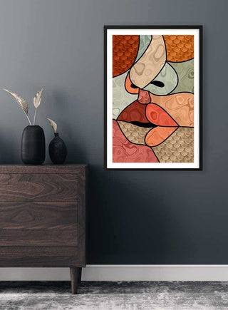 Framed Abstract Kiss Plakat with colorful, geometric shapes hanging on a dark wall above a modern cabinet.