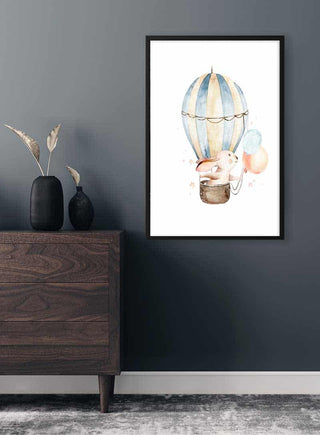 Poster of a rabbit in a hot air balloon with pastel balloons, hanging on a dark wall above a wooden dresser.