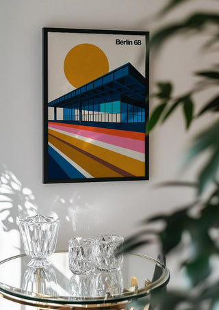 Berlin 68 by Bo Lundberg in a black frame above a glass table with crystal glassware