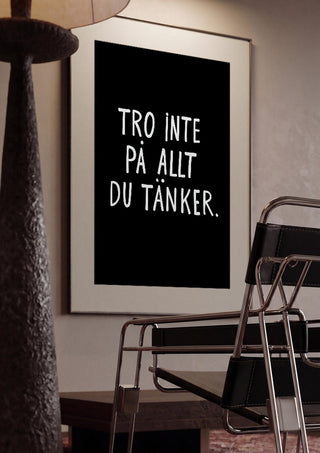 Tro inte på allt du tänker by Grafik bageri framed in a dim room beside a tubular steel chair