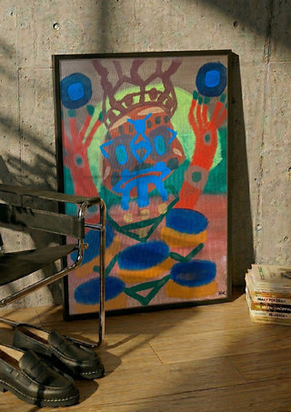 uppstigning by Hampus Nerén in a black frame leaning against a concrete wall by a steel chair