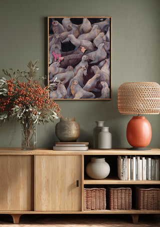 One with Nature by Daukantė above a wooden sideboard on a sage green wall