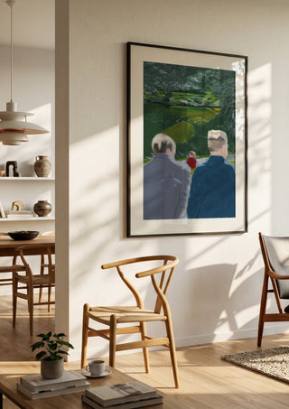 Koselig by Jaron Su in a black frame in a bright dining room with wooden chairs