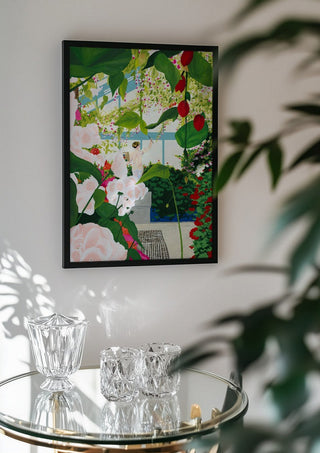 Artist paints in naked workshop by Jaron Su in a black frame above a glass table with crystal glassware