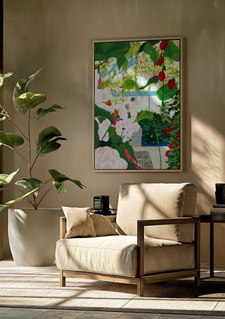 Artist paints in naked workshop by Jaron Su framed above a beige armchair beside a potted plant