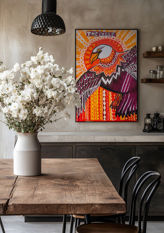 Eagle in the sky by ALEX in a black frame above a rustic table with white flowers