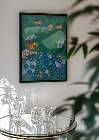 View from above by Gerard Ceulemans in a black frame above a glass table with crystal glassware