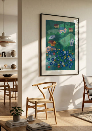 View from above by Gerard Ceulemans in a black frame in a bright dining room with wooden chairs