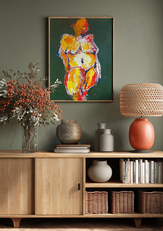 Standing Nude by René J above a wooden sideboard on a sage green wall
