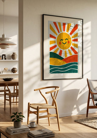 Smiling Sun by Decker Studios in a black frame in a bright dining room with wooden chairs