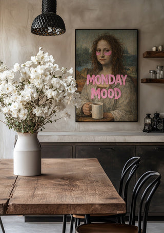 Monday Mood by Decker Studios in a black frame above a rustic table with white flowers