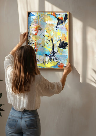 Composition Yellow on Blue by Andreas Pohle being hung on a sunlit wall