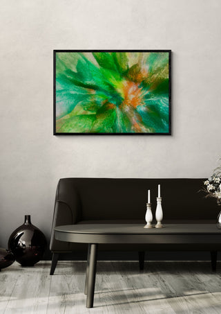 Emerald Burst by Da Winters in a black frame above a dark sofa with candlesticks and a vase