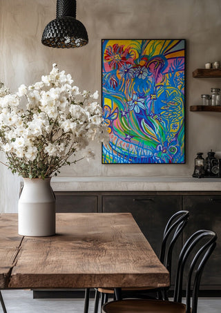 Garden Party by Da Winters in a black frame above a rustic table with white flowers