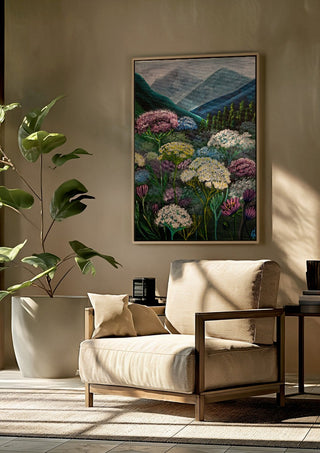 Mountain Meadow by Svetla Stoyanova Bassi framed above a beige armchair beside a potted plant