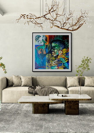 Black woman by Ralu in a black frame above a beige sofa under a branch chandelier