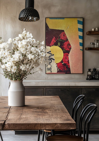 Roses by Kareem Rizk in a black frame above a rustic table with white flowers