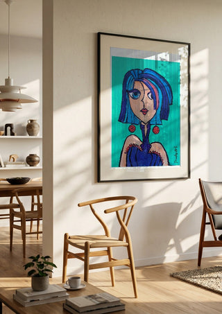 Lady Kontrast by Trude in a black frame in a bright dining room with wooden chairs
