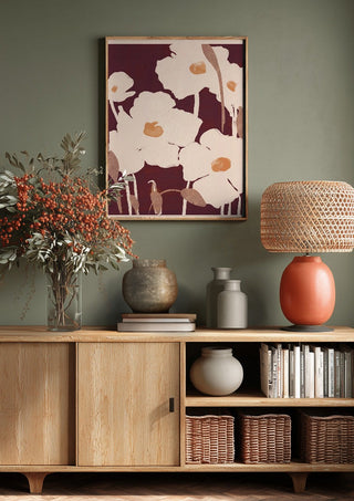 Abstract Flowers 10 by ThingDesign above a wooden sideboard on a sage green wall