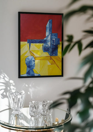 Facing the Monument by Linor Citaku in a black frame above a glass table with crystal glassware