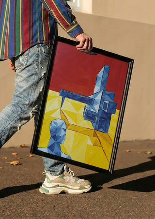 Facing the Monument by Linor Citaku carried in a black frame along a sunny street