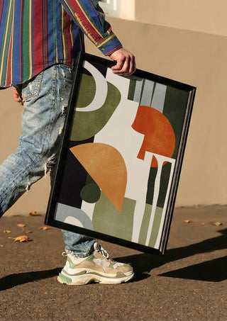 Abstract Art 42 by ThingDesign carried in a black frame along a sunny street