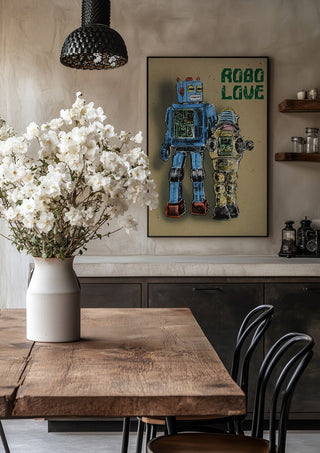 Robo Love by Carl Smith ART in a black frame above a rustic table with white flowers