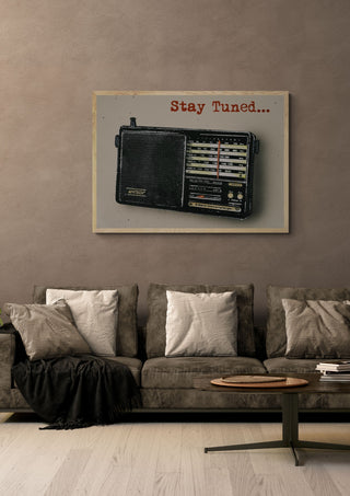 Stay Tuned by Carl Smith ART in a light oak frame above a grey sofa on a warm brown wall