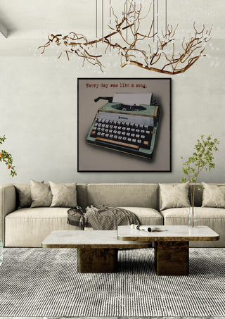 Like a Song by Carl Smith ART in a black frame above a cream sofa under a branch chandelier