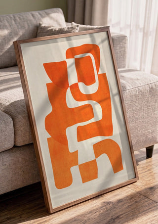 Abstract Art 55 - 7 by ThingDesign in a walnut frame leaning against a grey sofa