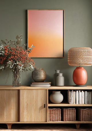 Sunset - cheerful, warm color gradient by Ohkimiko above a wooden sideboard on a sage green wall