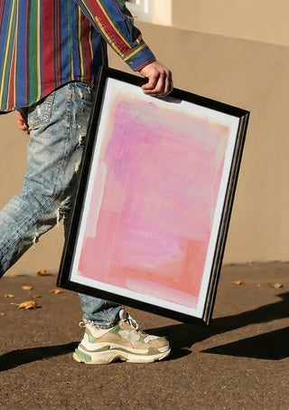 soft atmospheric colorfields by Iris Lehnhardt carried in a black frame along a sunny street