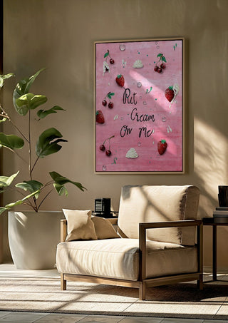 Put Cream On Me by KG Studio framed above a beige armchair beside a potted plant