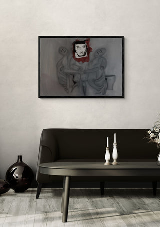 L. by Julian staal in a black frame above a dark sofa with candlesticks on a round table