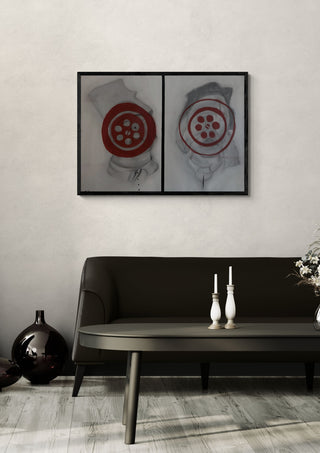 De maat by Julian staal in a black frame above a dark sofa with candlesticks on a round table