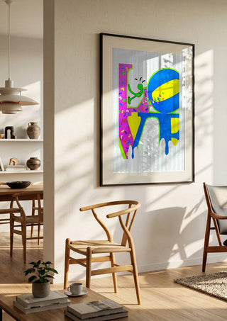 SAVE YOUR LOVE by NKo in a black frame in a bright dining room with wooden chairs