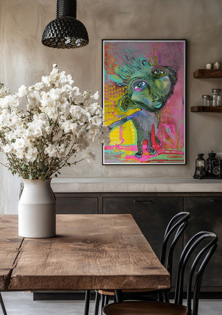 Strange Wanderer by Lena Galé in a black frame above a rustic table with white flowers