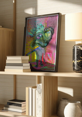 Strange Wanderer by Lena Galé in a dark frame on a wooden shelf beside books and a lamp