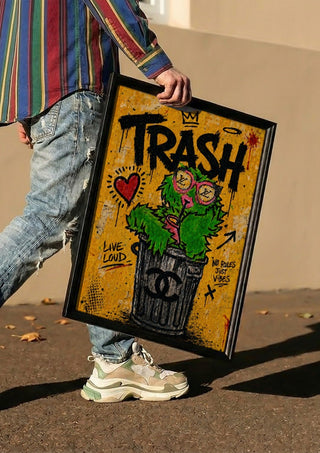 Trash x Grafitti by Decker Studios carried in a black frame along a sunny street