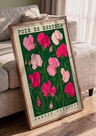 POIS DE SENTEUR by Annika Persson in a walnut frame leaning against a grey sofa