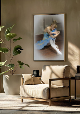 The Russian ballet dancer by Bettinafloorphoto framed above a beige armchair beside a potted plant
