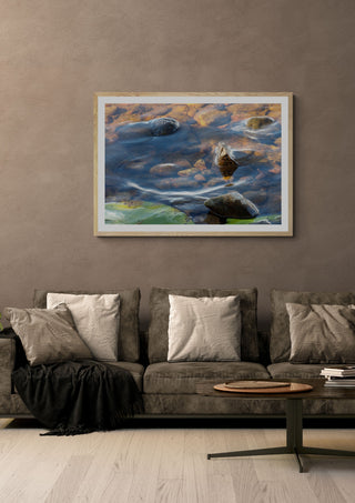 Sommar brus by Ljilja Marinic in a light oak frame on a warm grey wall above a brown sofa