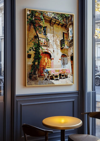 Italian courtyard by Massimo Frascogna in an oak frame on a panelled cafe wall