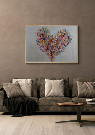 Herzblick by ullimcart in a light oak frame on a warm grey wall above a brown sofa