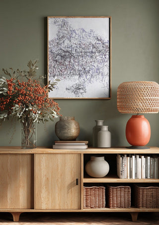 Nike by Priit Ruttas above a wooden sideboard on a sage green wall