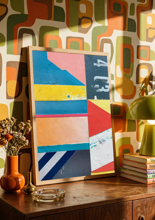 403 by Kareem Rizk in a wooden frame leaning on a sideboard against retro patterned wallpaper