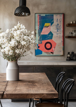 Abstract Composition No.2 by Kareem Rizk in a black frame above a rustic table with white flowers