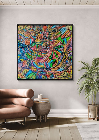 Colour Mosaic by Ronald Rumell in a black frame above a tan leather sofa beside a potted palm