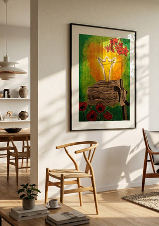 Die Wiederauferstehung by Olaf Baier in a black frame in a bright dining room with wooden chairs